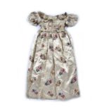 Cream silk skirt and bodice decorated with embroidered flowers all over, skirt 42cm across (when