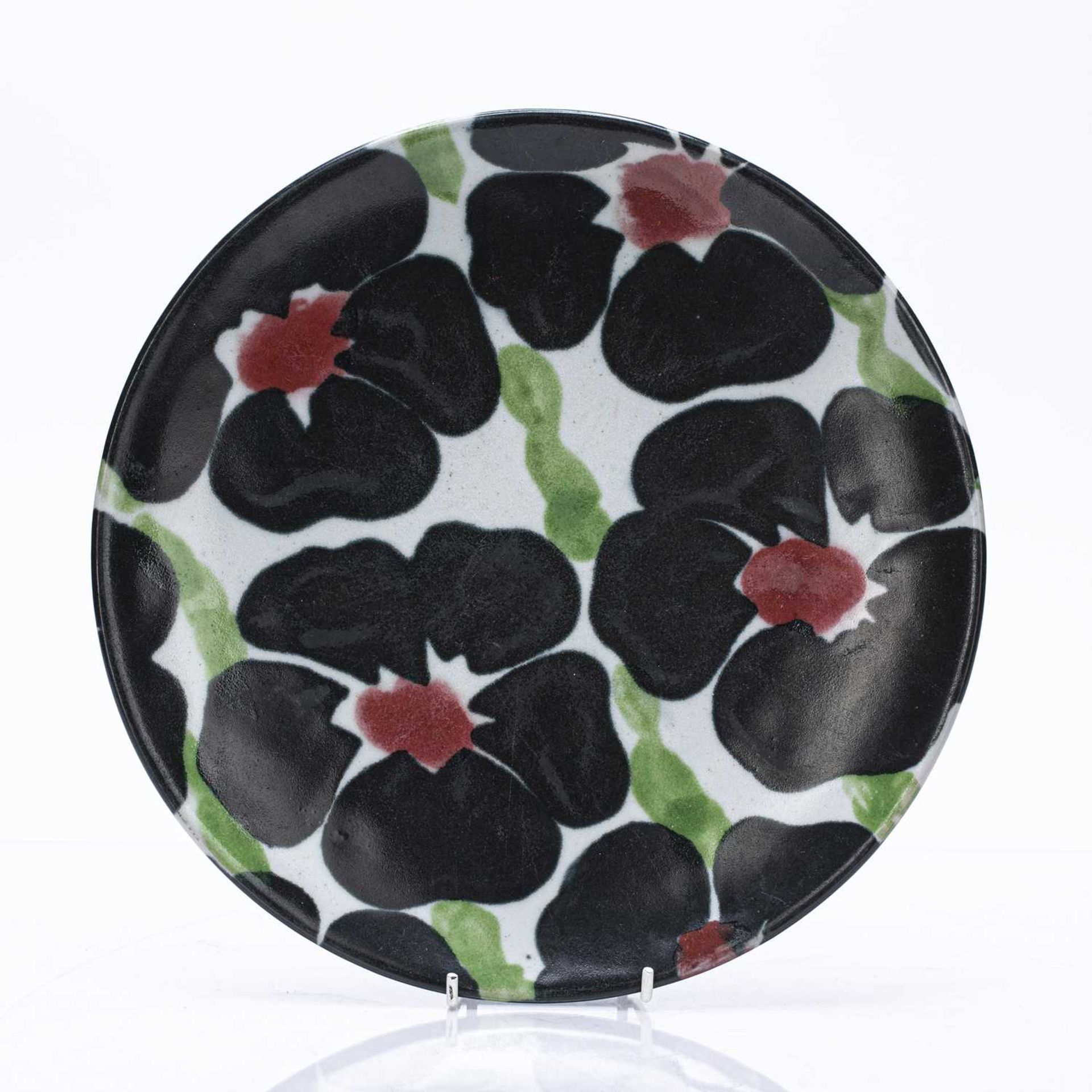 Janice Tchalenko (1942-2018) at Dartington Pottery studio pottery plate, decorated with flowers,