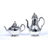 Victorian silver teapot and a Victorian silver coffee pot with matching gourd finials and foliate