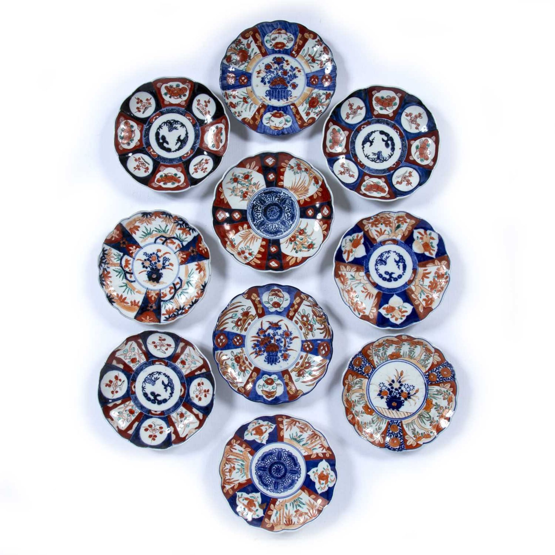 Ten Imari plates Japanese, decorated with bamboo and other plants in the imari palette, each plate