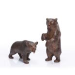 Two large Black Forest models of bears carved wood with painted details, one marked 'RM' the other