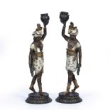 Pair of painted model spelter blackamoor candlesticks late 19th Century, 38cm highWorn and with