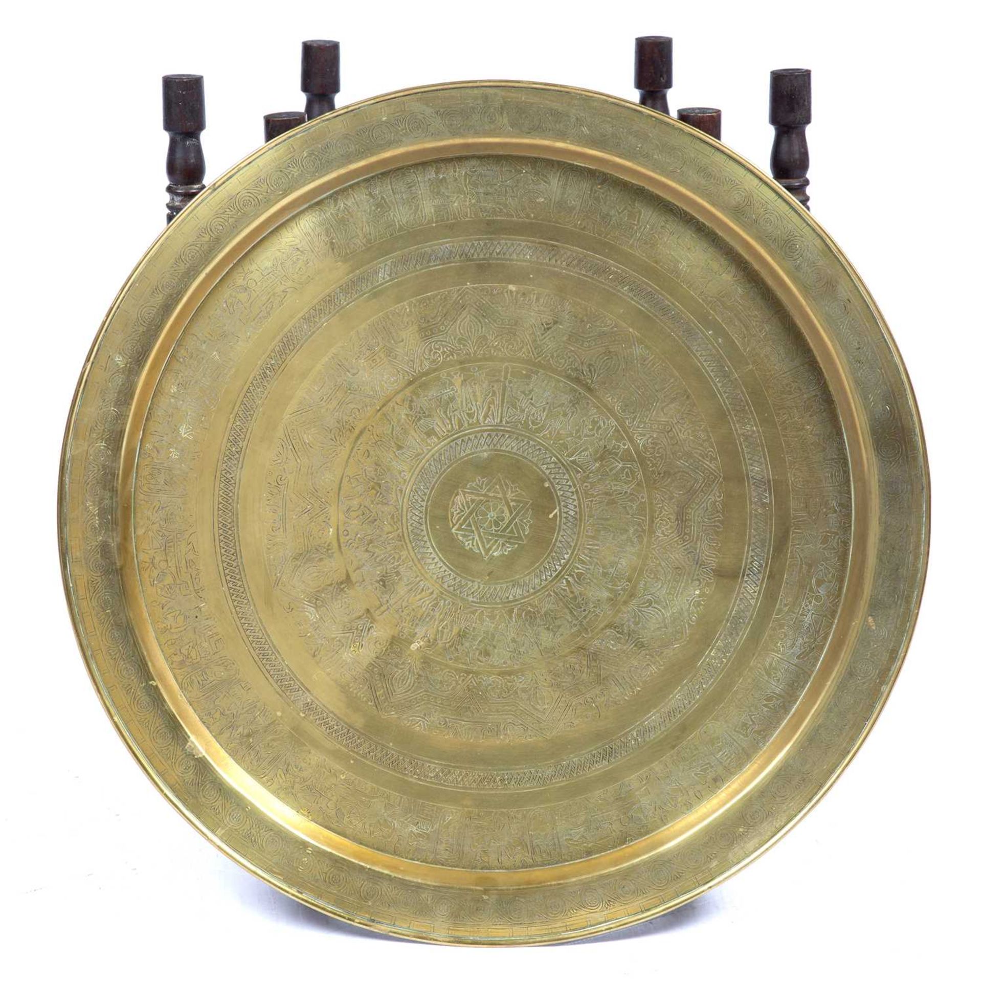 Benares brass tray on stand with typical engraved decoration, 58cm across Some marks. - Image 2 of 2