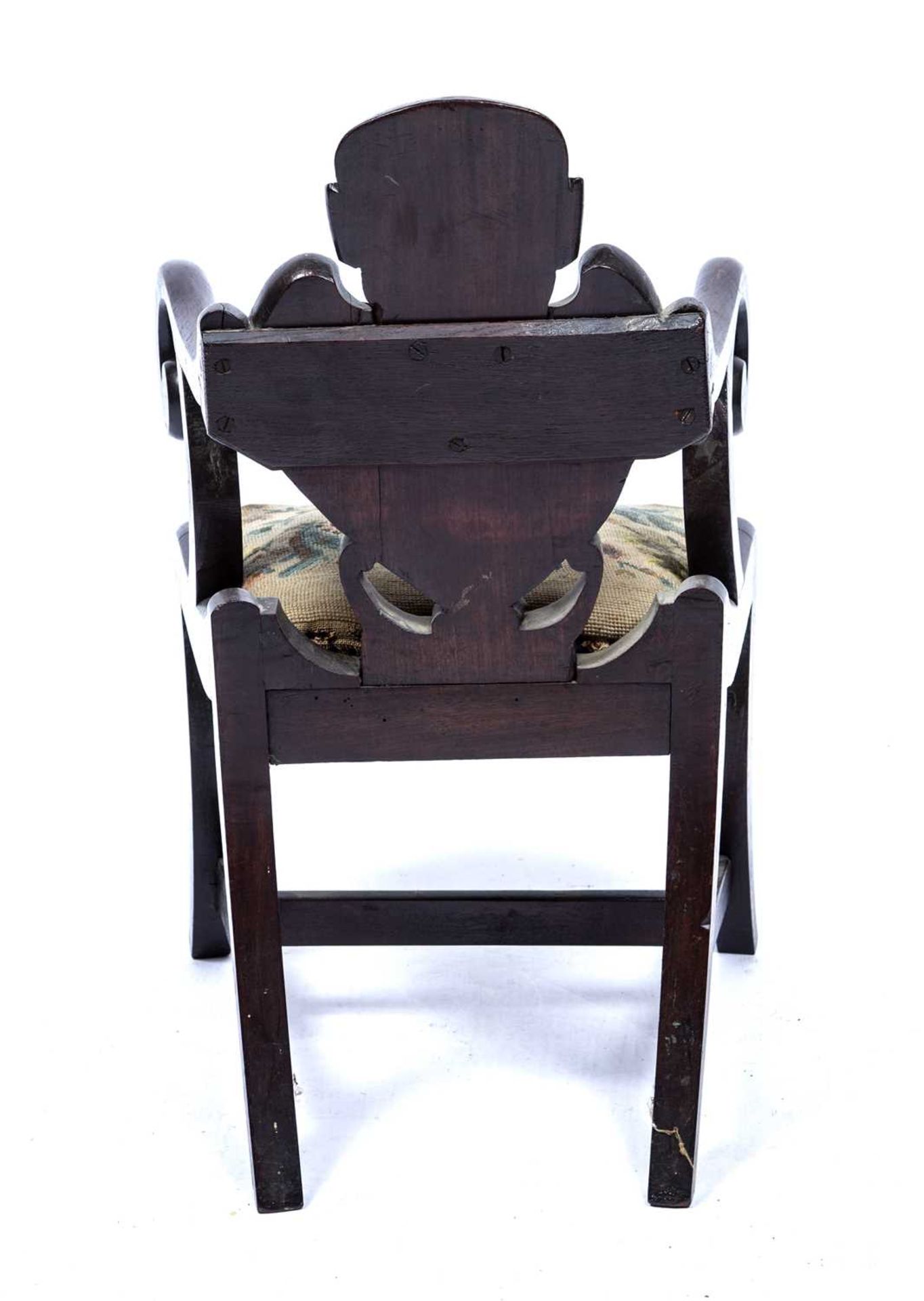 Carved childs chair with a skeleton back on sabre legs with a drop in seat, 64 cm high x 39cm - Image 4 of 4