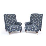 Pair of Howard style armchairs with blue kelim style upholstery, on turned wooden legs terminating