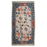 Ivory ground rug Tibetan, with Art Nouveau type decoration within a key and stylised border, 160cm x