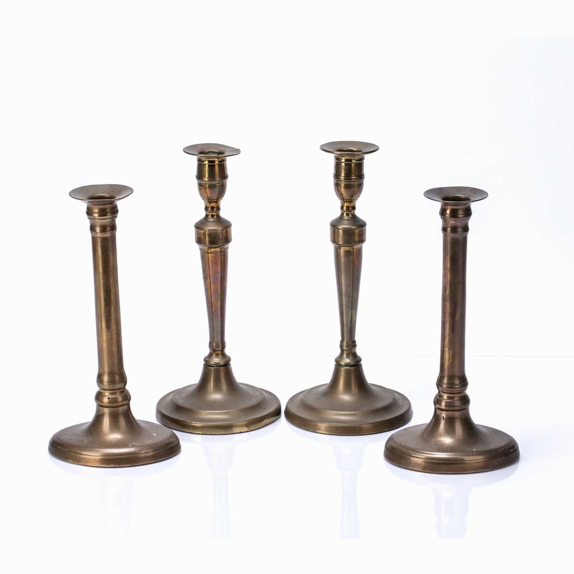 Two pairs of brass candle sticks one pair on a circular base, 25.5cm high, the other on navette - Image 2 of 2