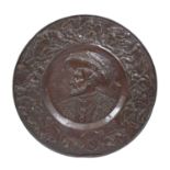 Large Flemish style copper plaque early 20th Century, with embossed central portrait profile, and