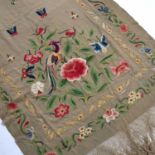 Silk long shawl Chinese, circa 1930, embroidered with peonies, insects and birds, 277cm x 67cmWith