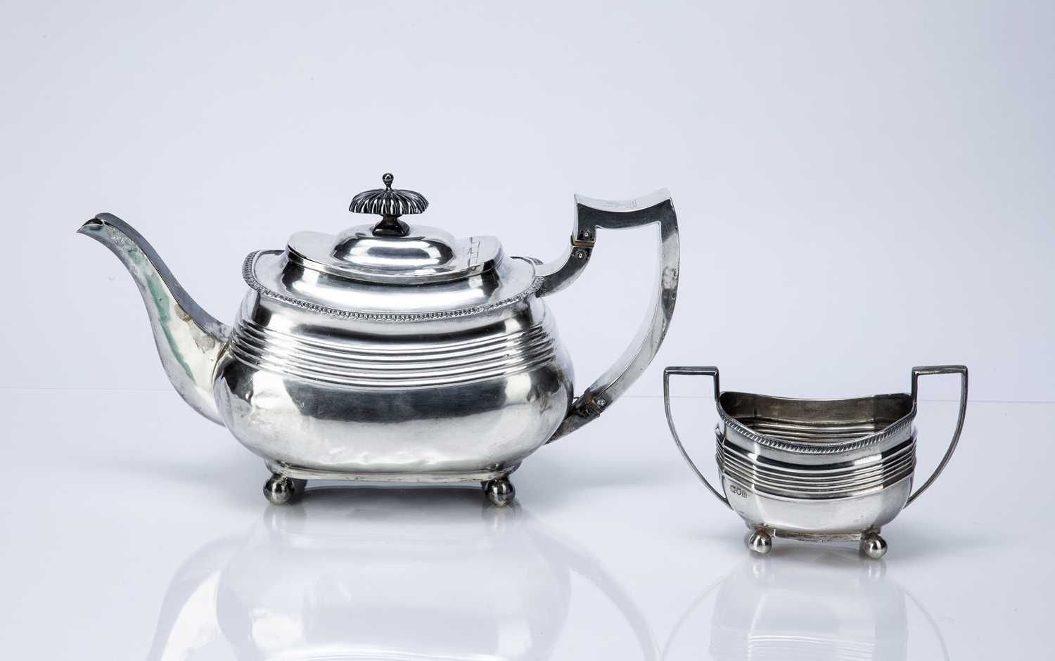 Georgian silver teapot and similar twin handled silver sucrier the teapot decorated with two - Image 2 of 6