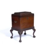 Mahogany cellarette circa 1900, with a lift up top, brass handles and on ball and claw feet, 60cm