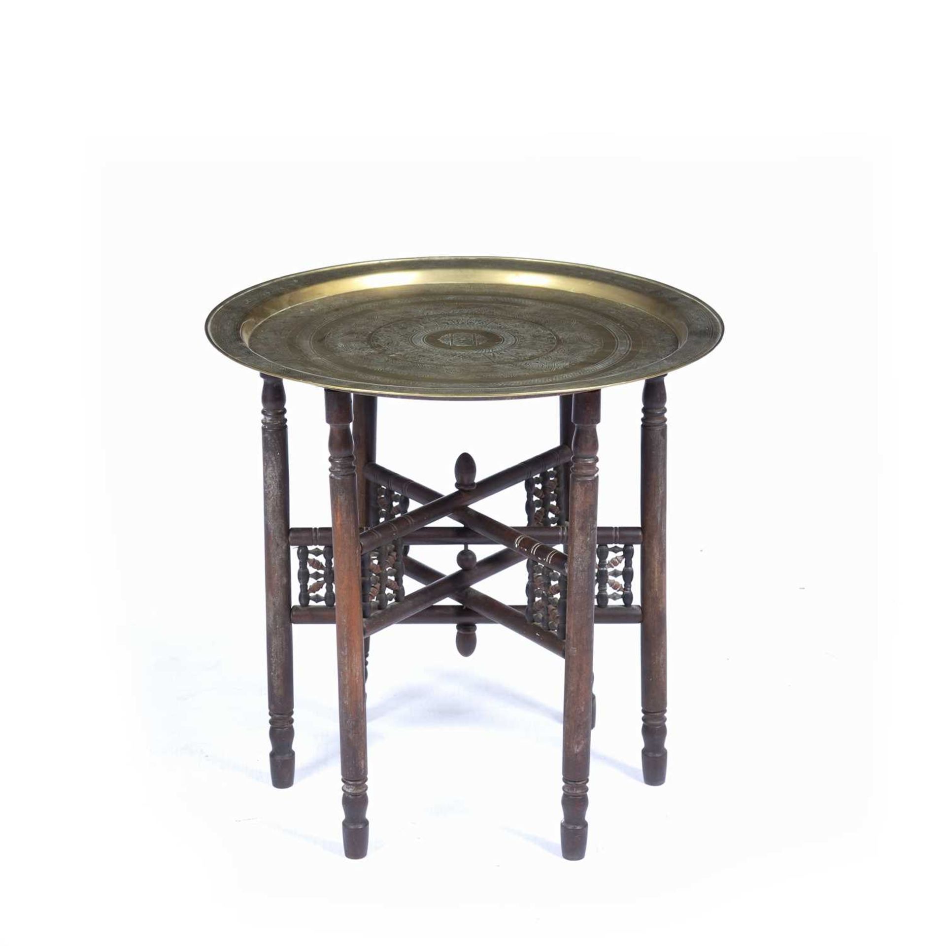 Benares brass tray on stand with typical engraved decoration, 58cm across Some marks.