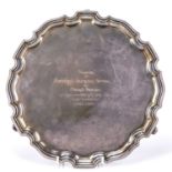 Elizabeth II silver salver standing on three scroll feet, bearing marks for Camelot Silverware