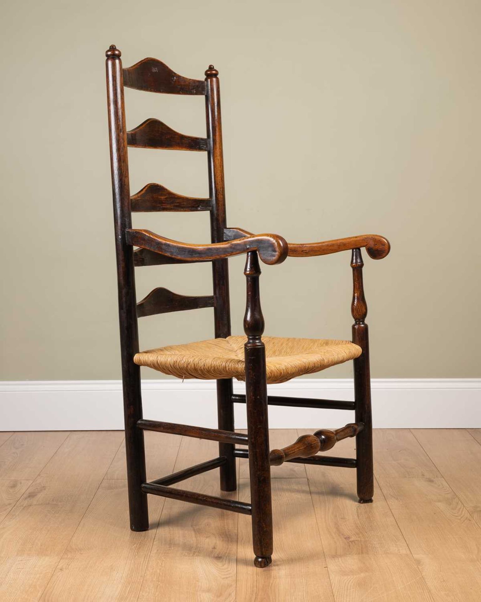 An ash framed ladder back chair with rush seat, stamped 'WA' to the seat back, on turned supports, - Image 2 of 3