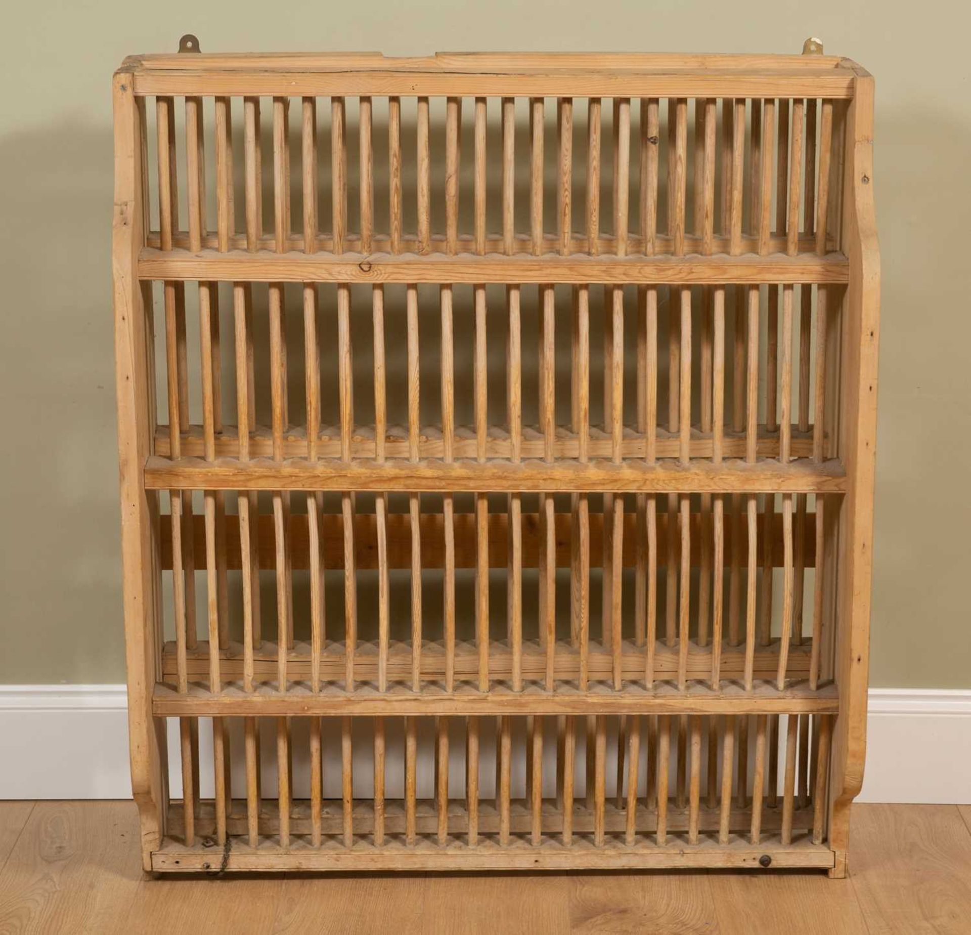 An Edwardian pine plate rack, 95cm wide, 32cm deep, 112cm highSome losses to the sides, possibly