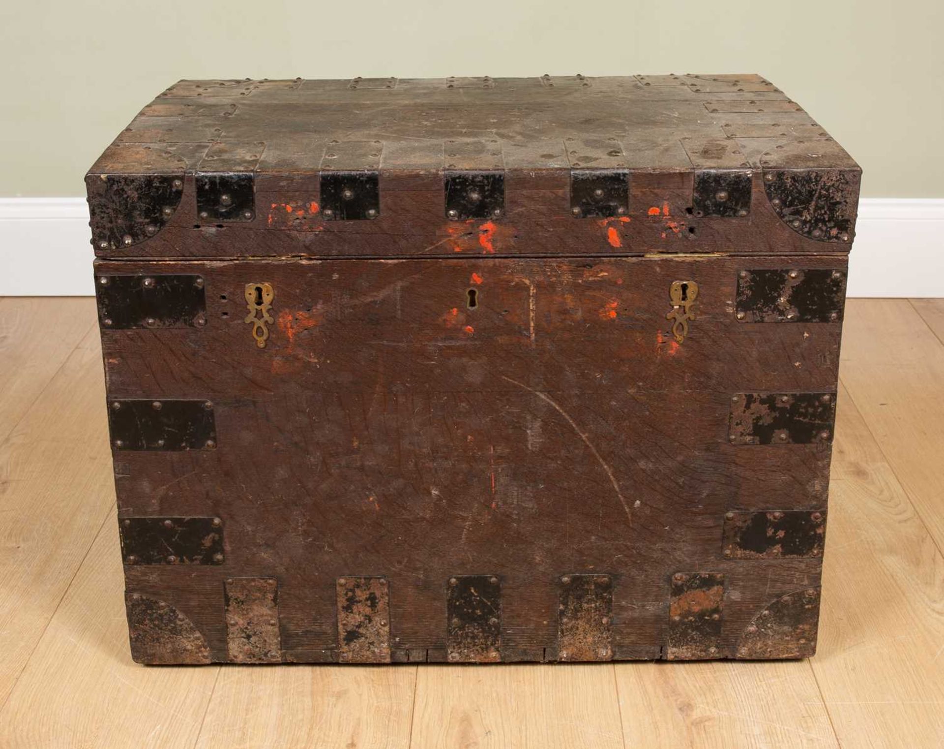 An antique oak iron-bound oak silver chest with carrying handles to the side, the baize lined