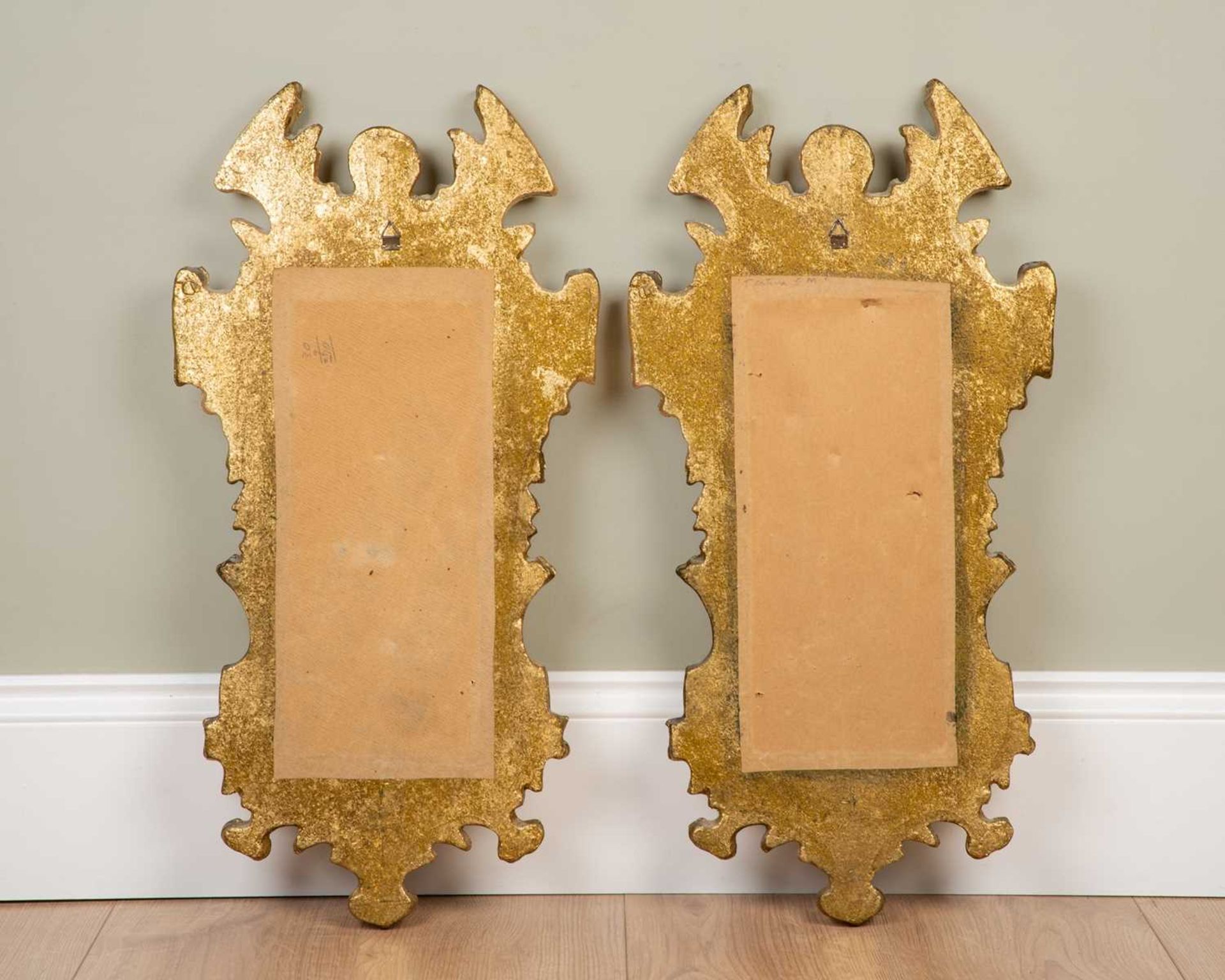 A pair of modern decorative gilt composite moulded wall mirrors with mask ornament to the break arch - Image 2 of 2