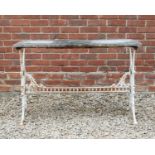 An antique rectangular conservatory table the marble top on a white painted cast iron base, the ends