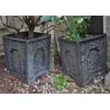 A pair of composite square section garden urns decorated in relief with George & the Dragon, 35cm