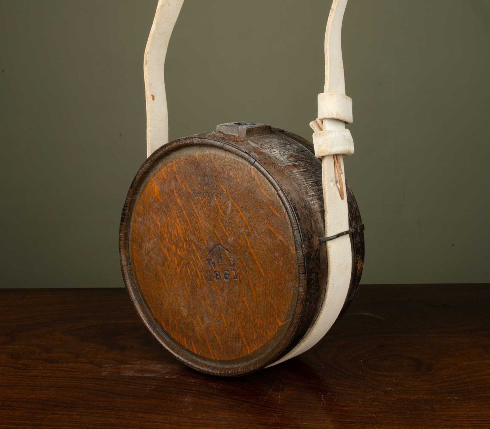 A 19th century coopered, iron bound soldier's canteen, stamped 'G Brown 1860', with later white