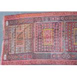 An early to mid 20th century Turkish flat weave red ground carpet 183cm x 395cmSome wear and
