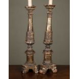 A pair of giltwood candlesticks converted for use as table lamps, 18th century and later, 60cm