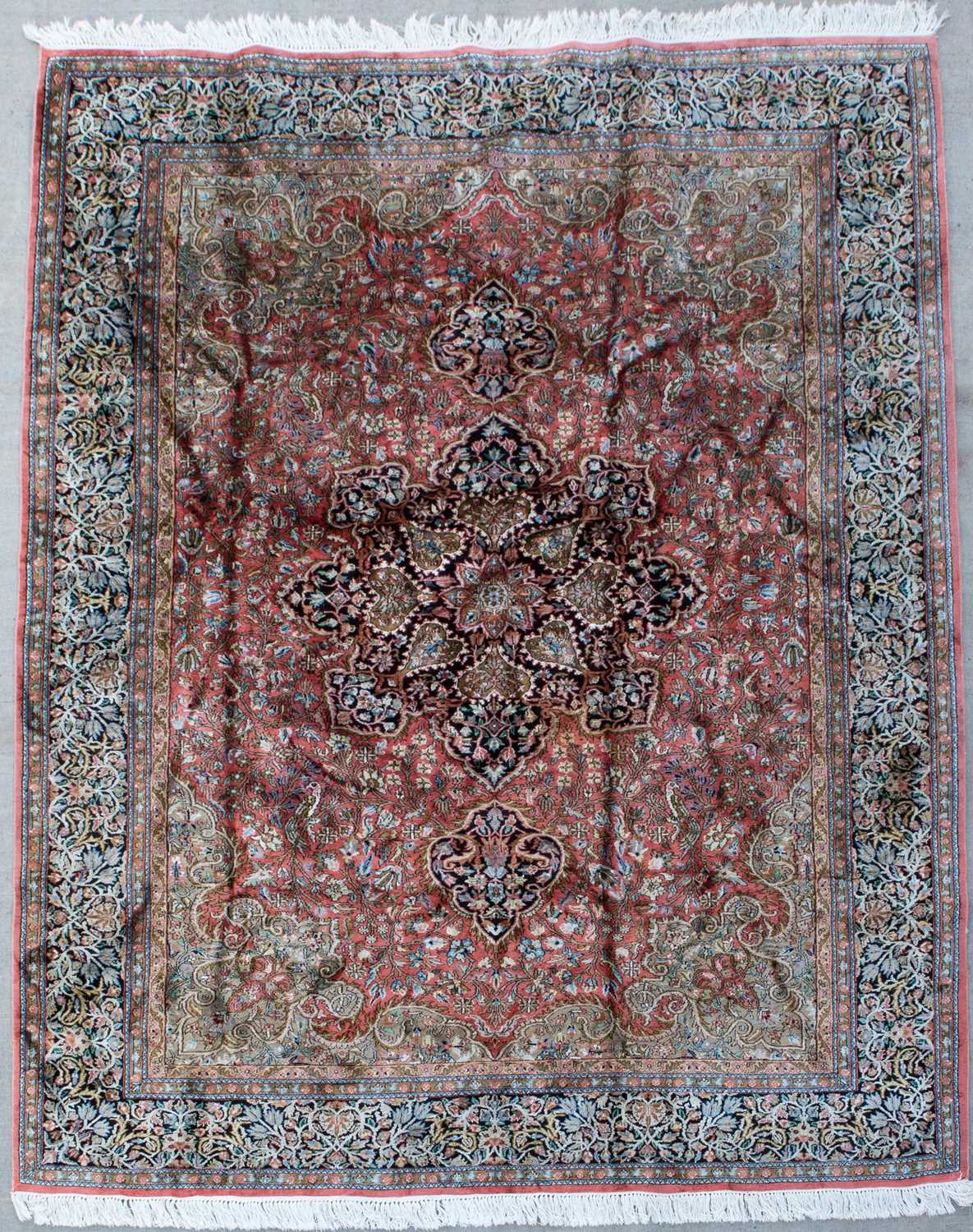 A 20th century Indian Kashmir silk rug with a detailed foliate decoration, 210cm x 208cmIn good