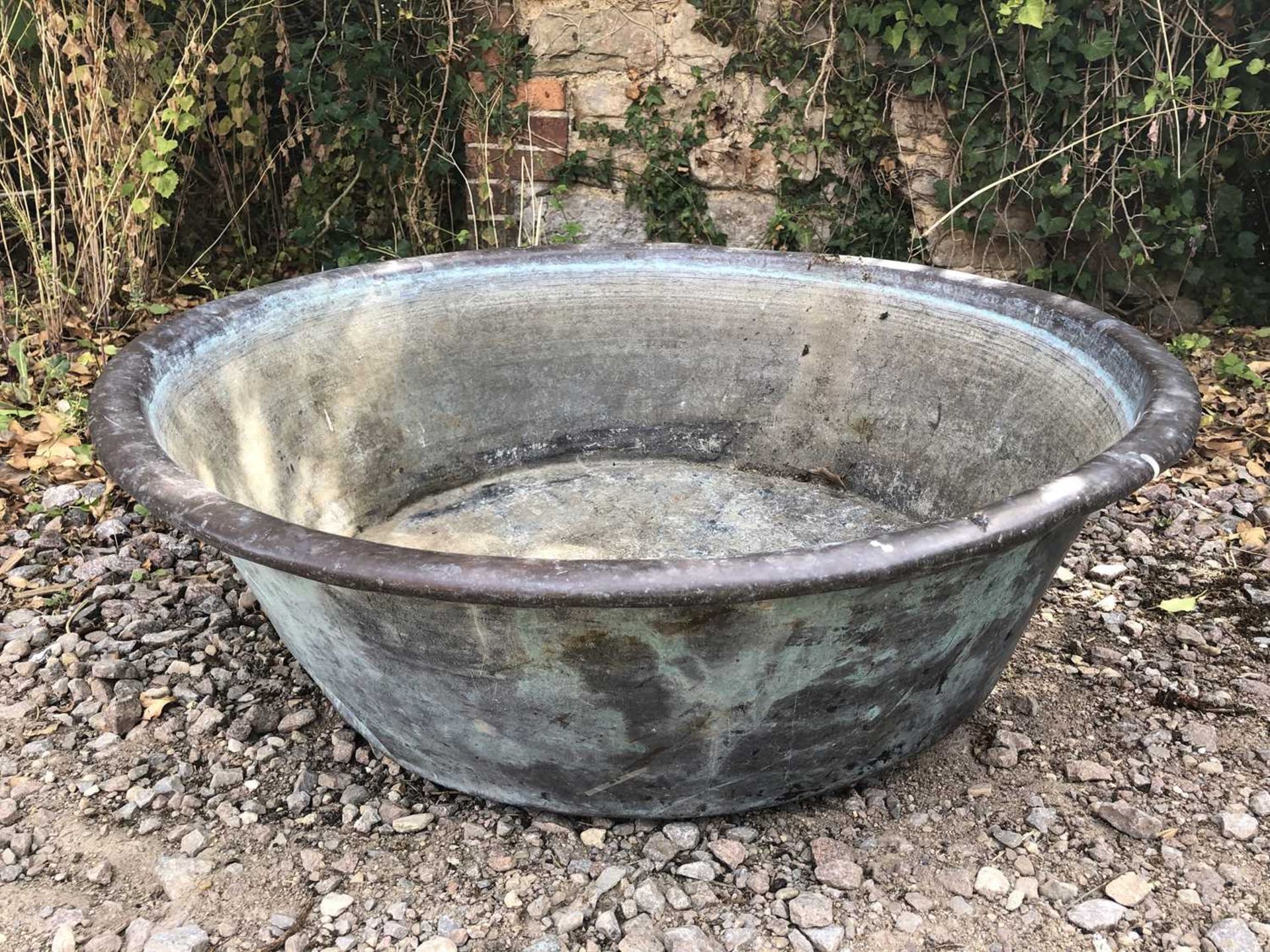 An old circular copper basin, 83cm diameter x 24cm highSome dents and marks overall, and oxidisation