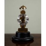 A 20th century German striking skeleton clock by Kieninger, under glass dome on ebonised wooden