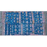 A blue ground Kelim with all over geometric decoration, 124cm x 200cmSome small holes, some