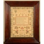 An early Victorian sampler by Matilda Boscawen, depicting a bible verse within a band floral border,