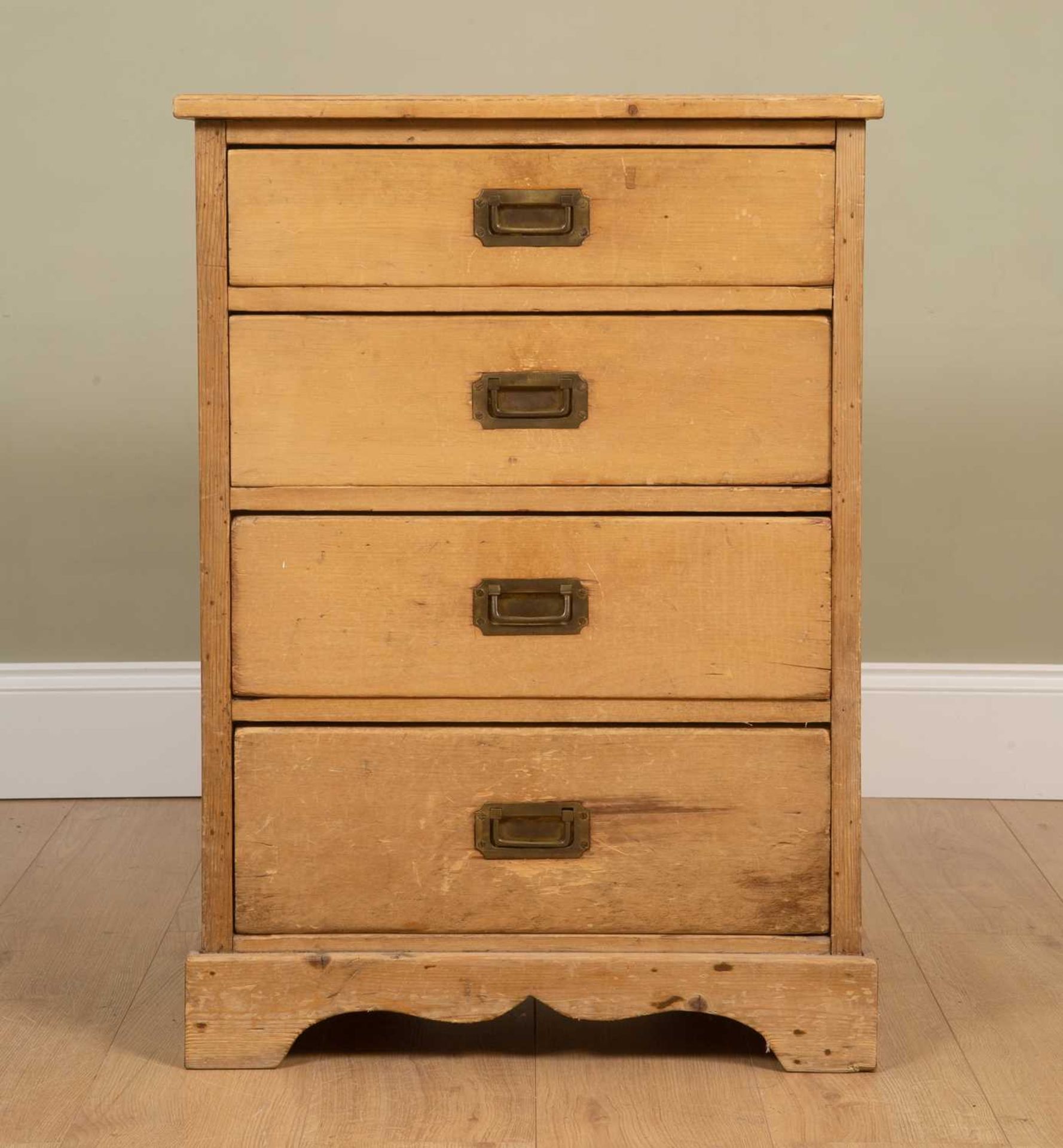 A small pine chest with four drawers, with brass inset handles on plinth base, 62cm wide x 46cm deep