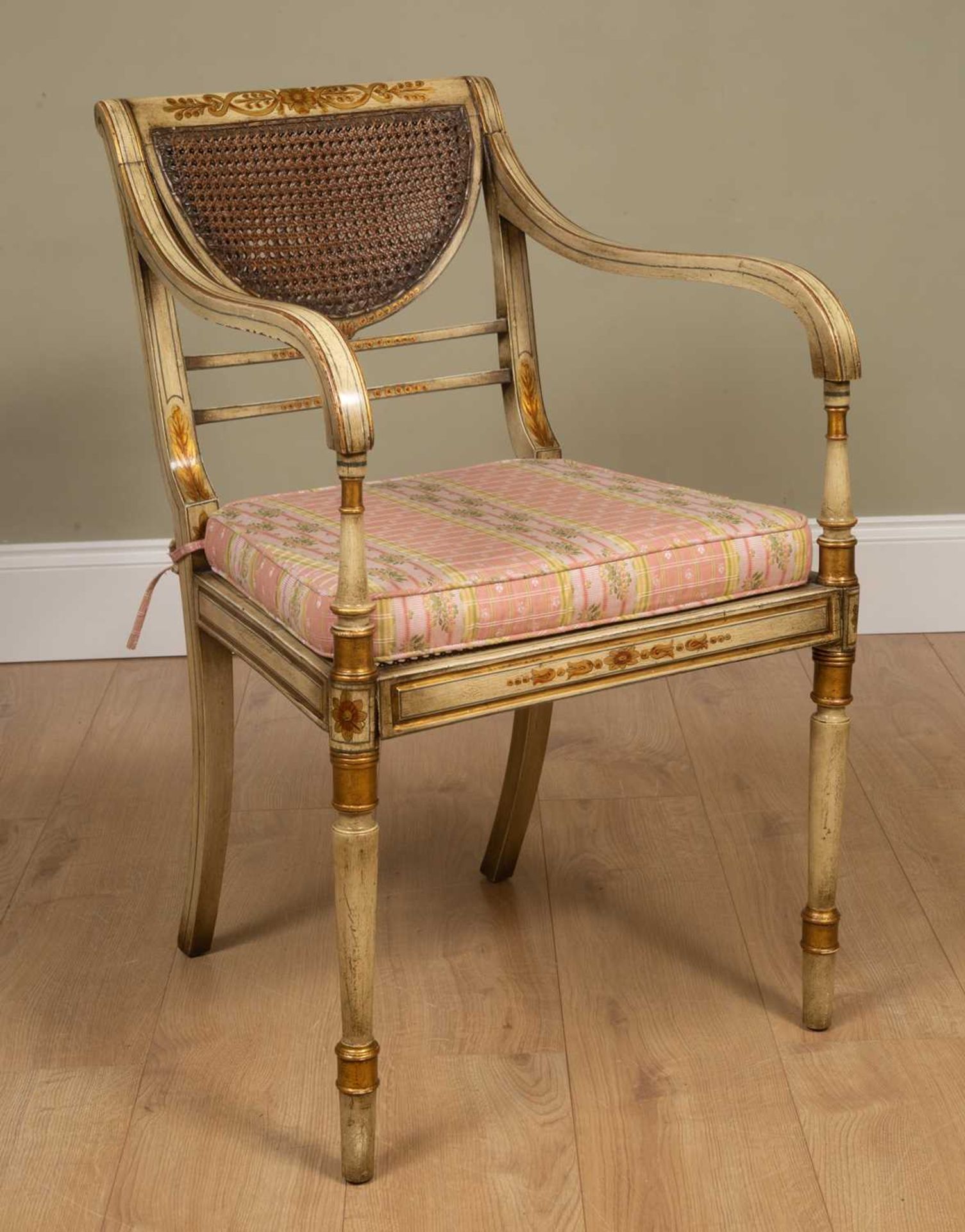 A Regency-style painted elbow chair, with caned back and seat, squab cushion, all standing on turned - Image 2 of 6