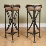 A pair of classically inspired turned marble basins, on black painted iron supports, with cast