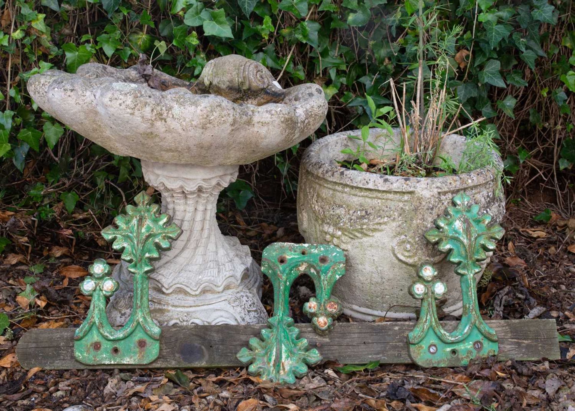 A small group of garden ornaments and other items consisting of; a small shell cast composite