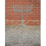 A green painted wirework conservatory or plant stand on a tripod base, 54cm diameter x 105cm