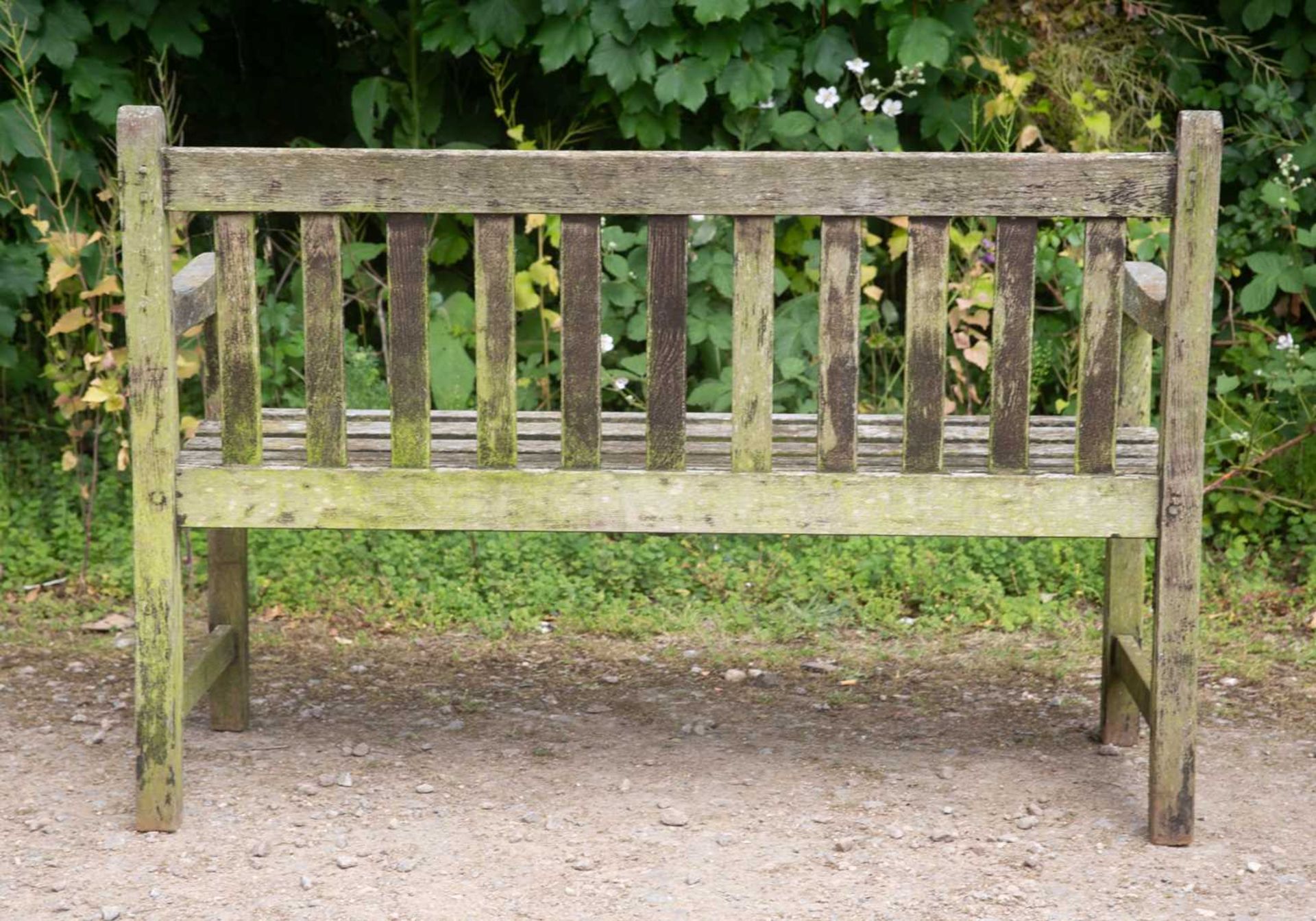 A small teak garden bench with slatted back and seat, 121.5cm wide, 55cm deep, 84cm highWeathered - Image 2 of 2