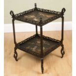An antique two-tier chinoiserie decorated black lacquered occasional table with pierced galleries to