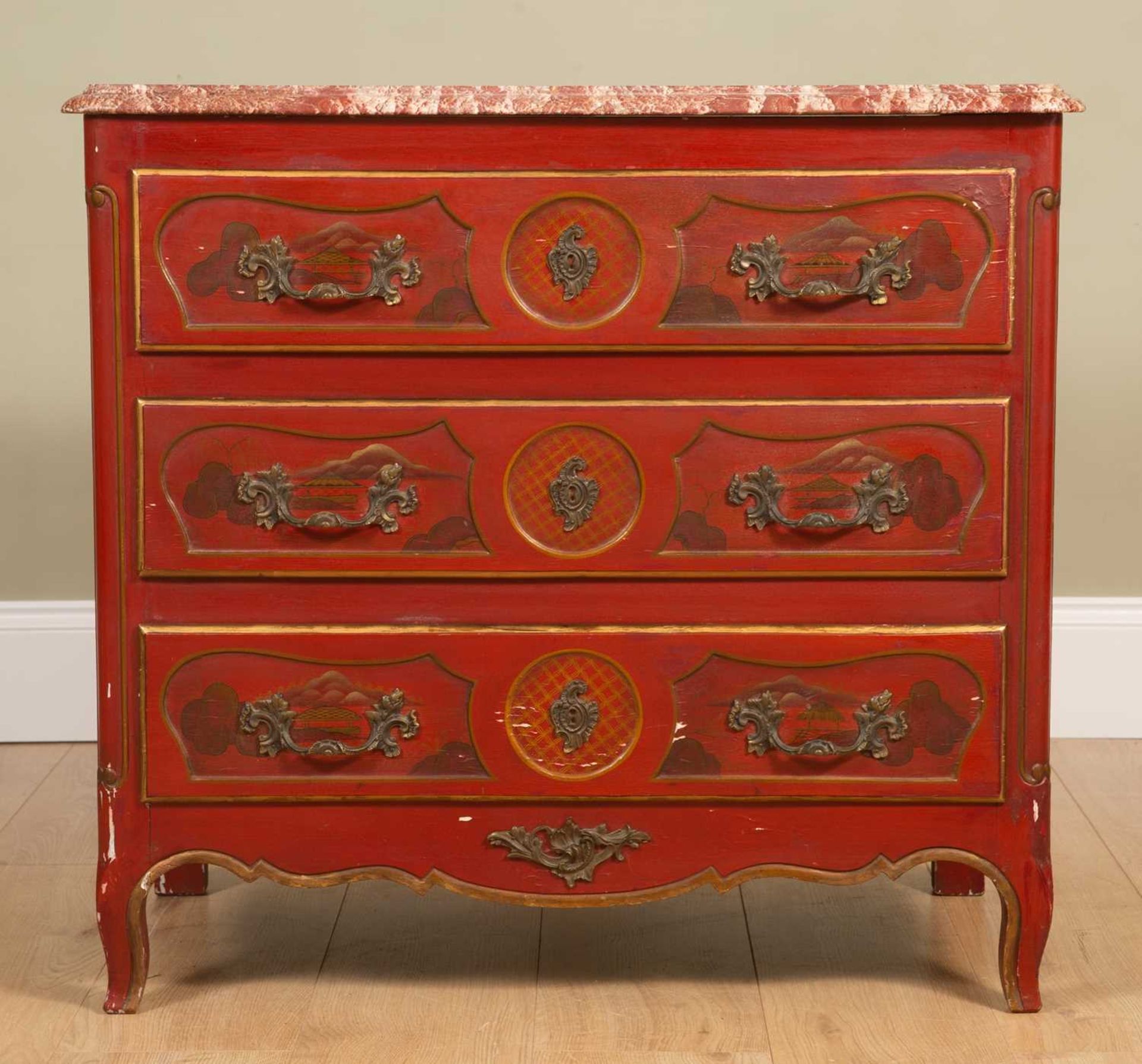 A red ground Jappaned marble-topped hardwood commode, with three drawers, panelled sides and on