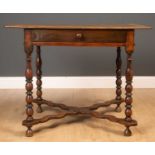 An early 18th century oak side table with square top, on turned supports united by an X-frame