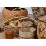 A large collection of wicker and rush baskets of varying sizes, the largest 36cm highSome baskets