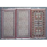 Three decorative machine made rugs all 99cm x 200cmModerate to good condition, with some minor wear
