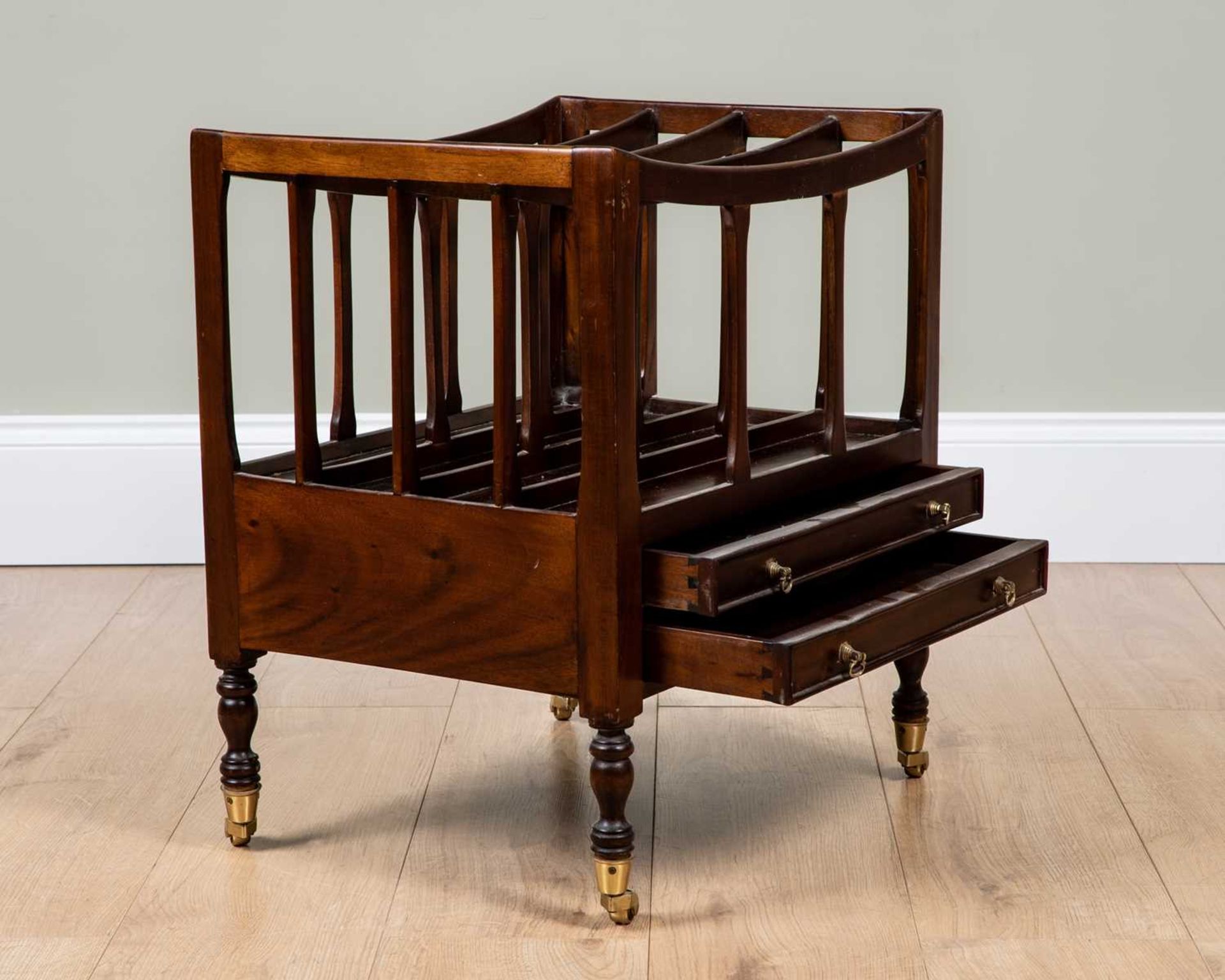 A mahogany four division Canterbury on turned supports and castors, 49cm wide, 38cm deep, 57cm - Image 2 of 2