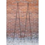 A pair of wrought iron conical garden rose supports, both with a ball finial, standing 206cm