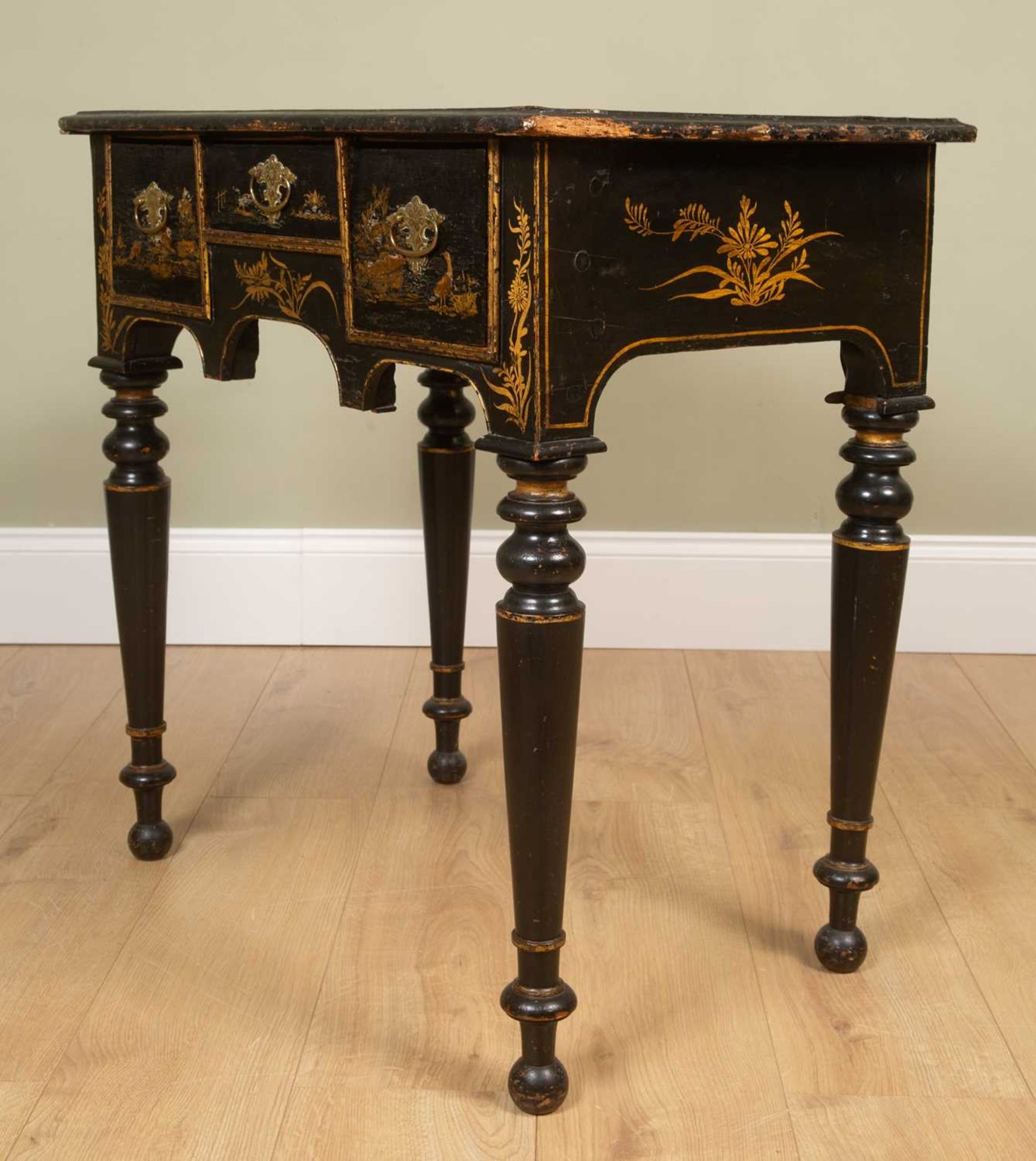 An early 18th century and later black lacquered chinoiserie decorated lowboy, with village and - Image 2 of 7