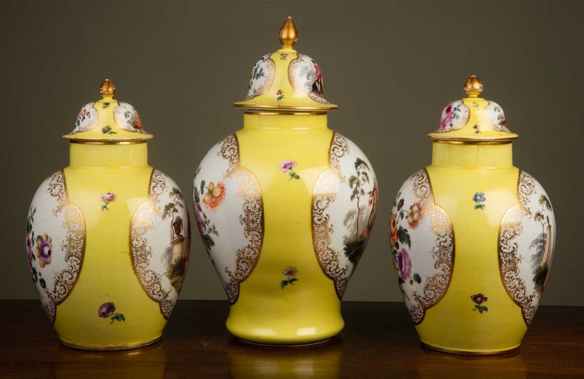 A garniture of three Dresden yellow ground ovoid vases and covers decorated to one side with - Image 3 of 4