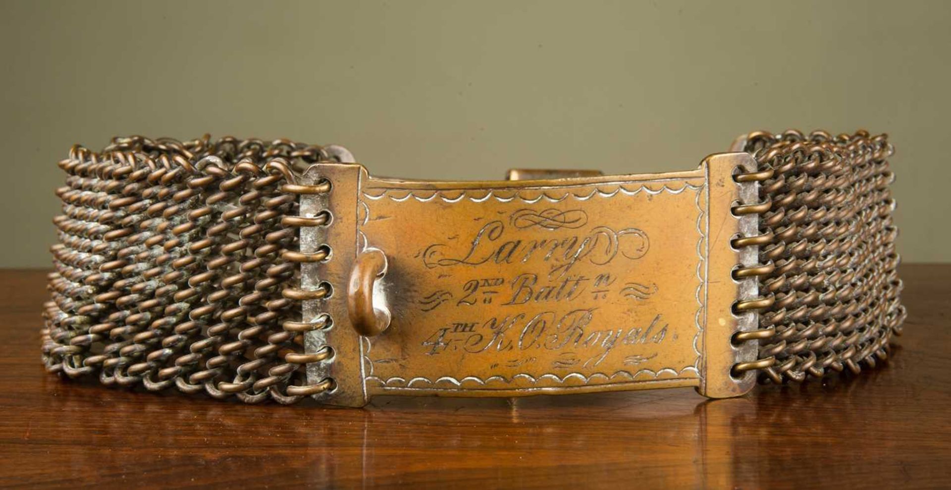 A 19th or early 20th century brass animal collar, possibly a goat, the collar inscribed 'Larry,