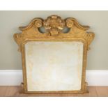 An 18th century giltwood dressing table mirror, with break scroll pediment and shield crest, 55cm