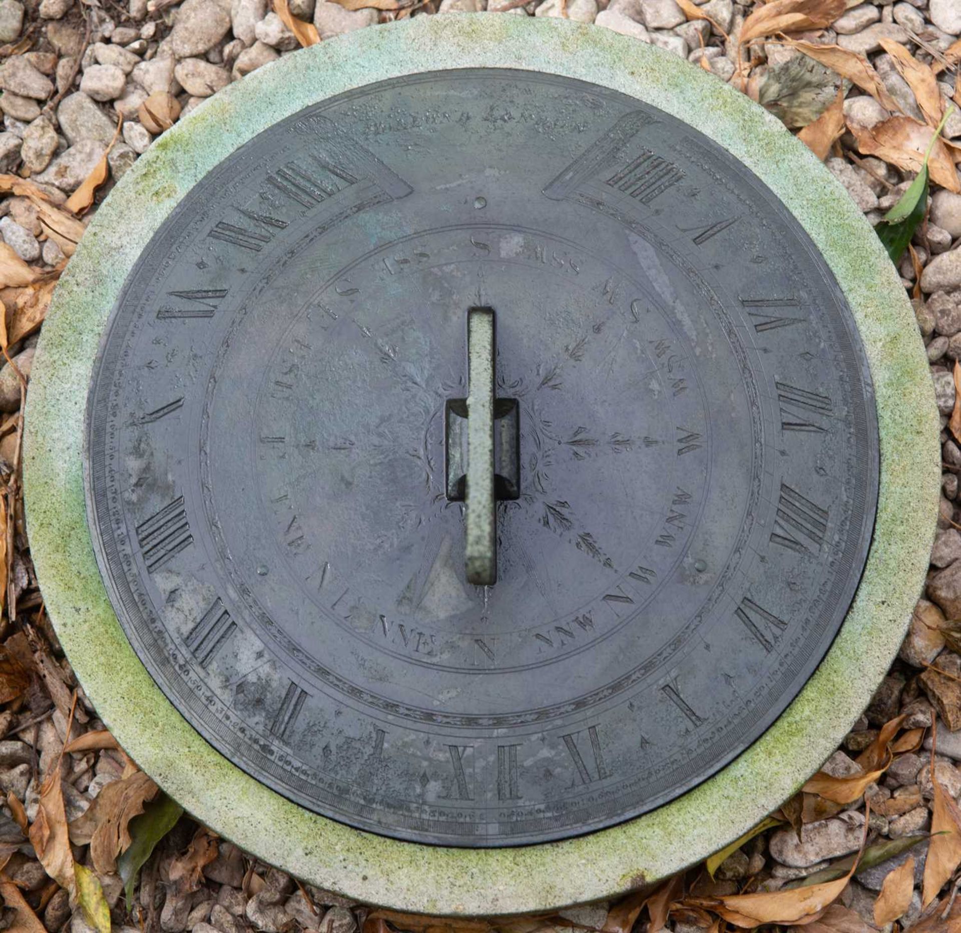 An early 19th Century Sundial by Dolland, the finely engraved bronze dial on a turned stone - Image 2 of 3