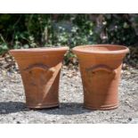 A pair of terracotta Whichford garden planters, with moulded handles, 33cm diameter x 34cm highOne